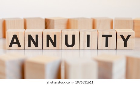 The Word ANNUITY Is Written On A Wooden Cubes Structure. Blocks On A Bright Background. Can Be Used For Business And Financial Concept. Selective Focus.