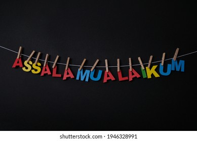 Word Assalamualaikum on black background. Assalamualaikum the Arabic greeting meaning "Peace be unto you," was the standard salutation among members of the Nation of Islam.