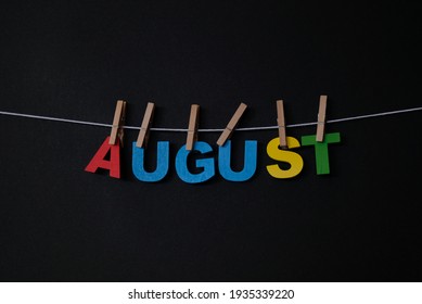 Word August On Black Background. August Is The Eighth Month Of The Year In The Julian And Gregorian Calendars.