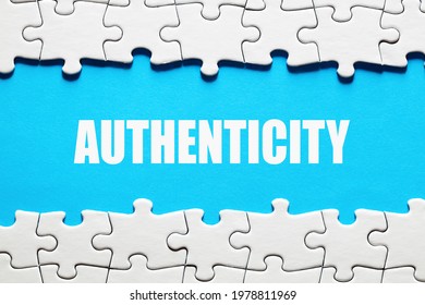 The Word Authenticity On Blue Background Framed By Jigsaw Puzzle Pieces. To Discover Or Reveal The Truth, Reality Or Reliability Concept.