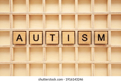 Word Autism made with wooden cubes. Concept about autism spectrum disorder ASD. - Shutterstock ID 1916143246