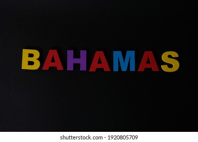 Word Bahamas On Black Background. The Bahamas, Known Officially As The Commonwealth Of The Bahamas, Is A Country Within The Lucayan Archipelago Of The West Indies In The Atlantic.