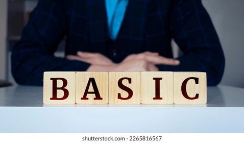 The word 'Basic' written on wood cube.