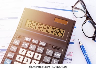 Word BENEFICIARY on the display of a calculator on financial documents. - Shutterstock ID 1941224203