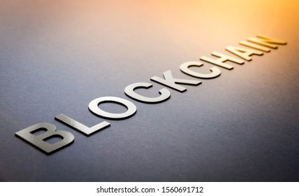 Word blockchain written with white solid letters on a board