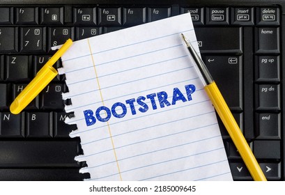 Word Bootstrap On Paper And Laptop. Bootstrap CSS Framework
