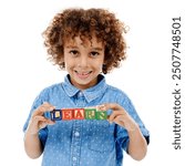 Word, building blocks and portrait of kid in studio for learning, education or child development. Creative, childhood and isolated young boy with school toys for spelling games on white background