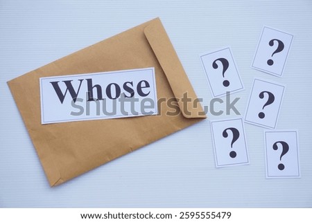  Word cards with question word Whose on brown envelope and cards of question marks. Concept. Teaching aid. Education materials for teach WH- question. Asking questions.                                