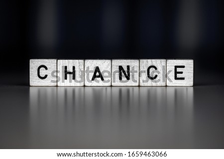 Similar – Small wooden cubes with the word Chance