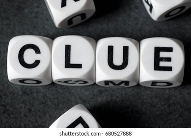 Word Clue On White Toy Cubes