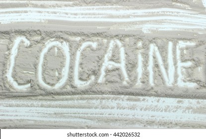 Word Cocaine written over white powder - Shutterstock ID 442026532