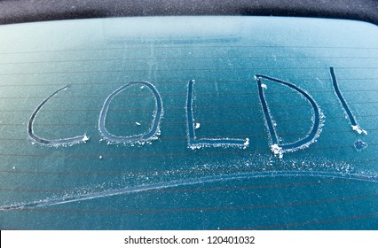 The Word Cold Written On A Frozen Car Screen