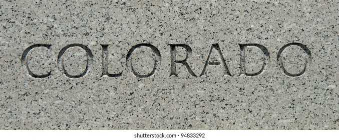 The word "Colorado" carved into granite