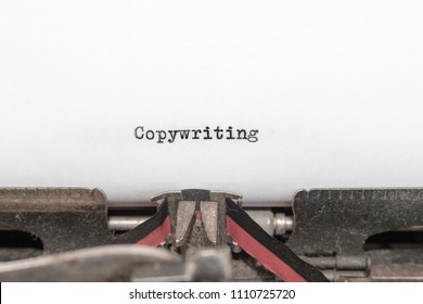 The Word Copywriting Typed By An Antique Typewriter On White Paper. Business Concept Of Writing, Copy, Editing, Journalism.