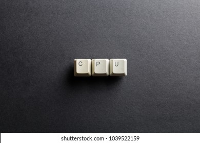 Word CPU made using computer keyboard buttons on a black background. Central processing unit. IT technology concept.