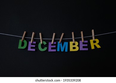 Word December On Black Background. December Is The Twelve And Final Month Of The Year In The Julian And Gregorian Calendars.