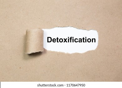 The Word Detoxification Appearing Behind Ripped Paper.