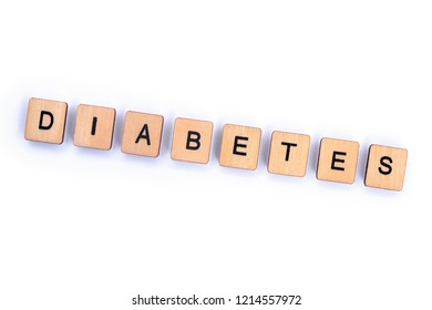The word DIABETES, spelt with wooden letter tiles over a plain white background.  - Shutterstock ID 1214557972