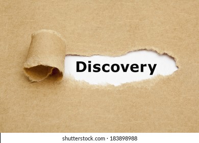 The Word Discovery Appearing Behind Torn Brown Paper.