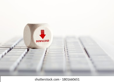 The word download with arrow icon on wooden cube with computer keyboard. Data downloading concept.  - Shutterstock ID 1801660651