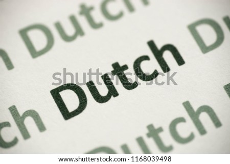 word Dutch language printed on white paper macro