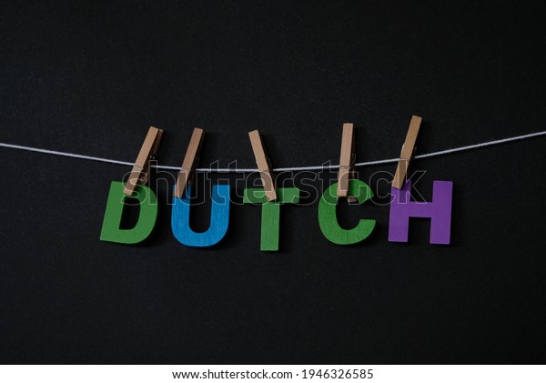 Word Dutch on black background. In\
Dutch, the names for the Netherlands, the Dutch language and a\
Dutch citizen are Nederland, Nederlands and\
Nederlander.