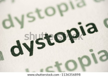 word dystopia printed on white paper macro