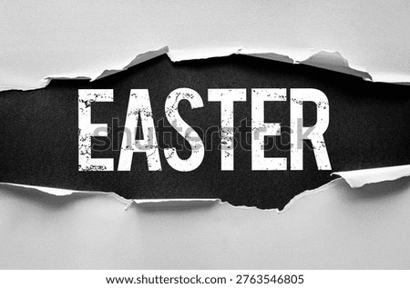 Word EASTER revealed through a torn paper background with a bold, textured font. Concept image for holiday, celebration, resurrection, religion, springtime, or festive announcement