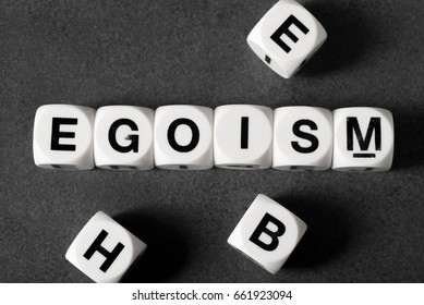 Word Egoism On White Toy Cubes