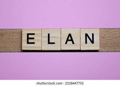 word elan from small gray wooden letters lies on a pink background - Shutterstock ID 2218447755