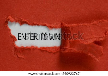The word Enter to Win appearing behind torn red paper
