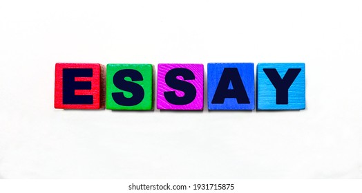 The Word ESSAY Is Written On Colorful Cubes On A Light Background