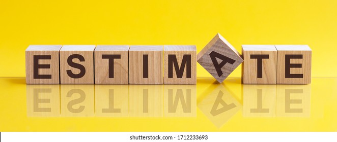 Word ESTIMATE Is Made Of Wooden Building Blocks Lying On The Table And On A Light Yellow Background. Concept