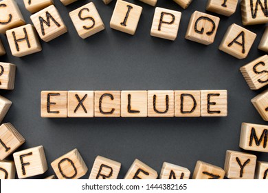 word exclude composed of wooden cubes with letters, not include something  concept, scattered around the cubes random letters, top view on gray background - Shutterstock ID 1444382165