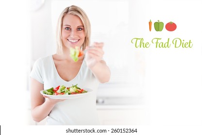 The Word The Fad Diet Against Close Up Of A Good Looking Woman Eating Salad