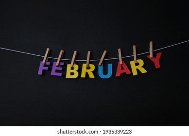 Word February On Black Background. February Is The Second Month Of The Year In The Julian And Gregorian Calendars. 