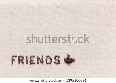The word friends next to a hot coffee mug all made up from coffee beans ,aligned at the bottom left.