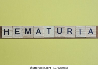 Word Hematuria Made From Wooden Letters Lies On A Yellow Table