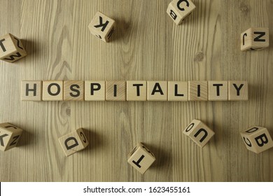 Word Hospitality From Wooden Blocks On Desk, Business Concept