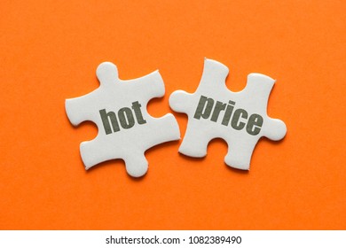 The Word HOT PRICE On Two Matching Puzzle On Orange Background.