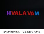 Word Hvala vam on black background. Hvala vam is defined as thank you in Croation.