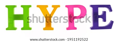 The word hype is lined with multicolored plastic letters isolated on white background.