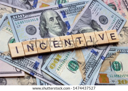The word incentive on dollar usa background