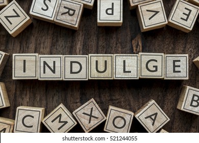 The Word Of INDULGE On Building Blocks Concept