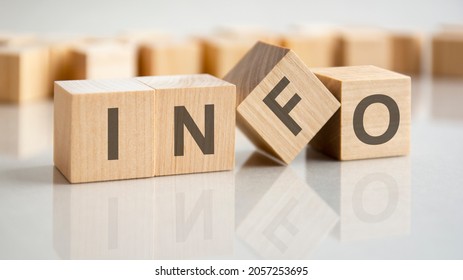 the word info is written on a wooden cubes structure. Blocks on a bright gray background. Selective focus. - Shutterstock ID 2057253695