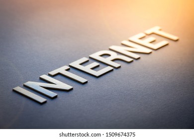 Word internet written with white solid letters on a board