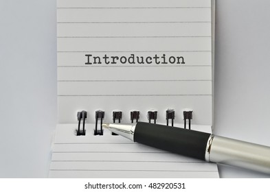 Word Introduction Written On Paper And A Pen