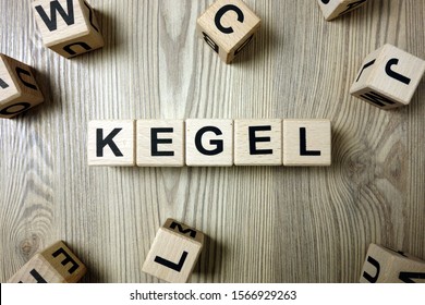 Word kegel from wooden blocks on desk