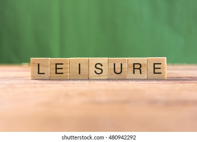 the word of LEISURE on wood tiles concept - Powered by Shutterstock