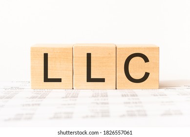 Word LLC- Limited Liability Company made with wood building blocks, stock image